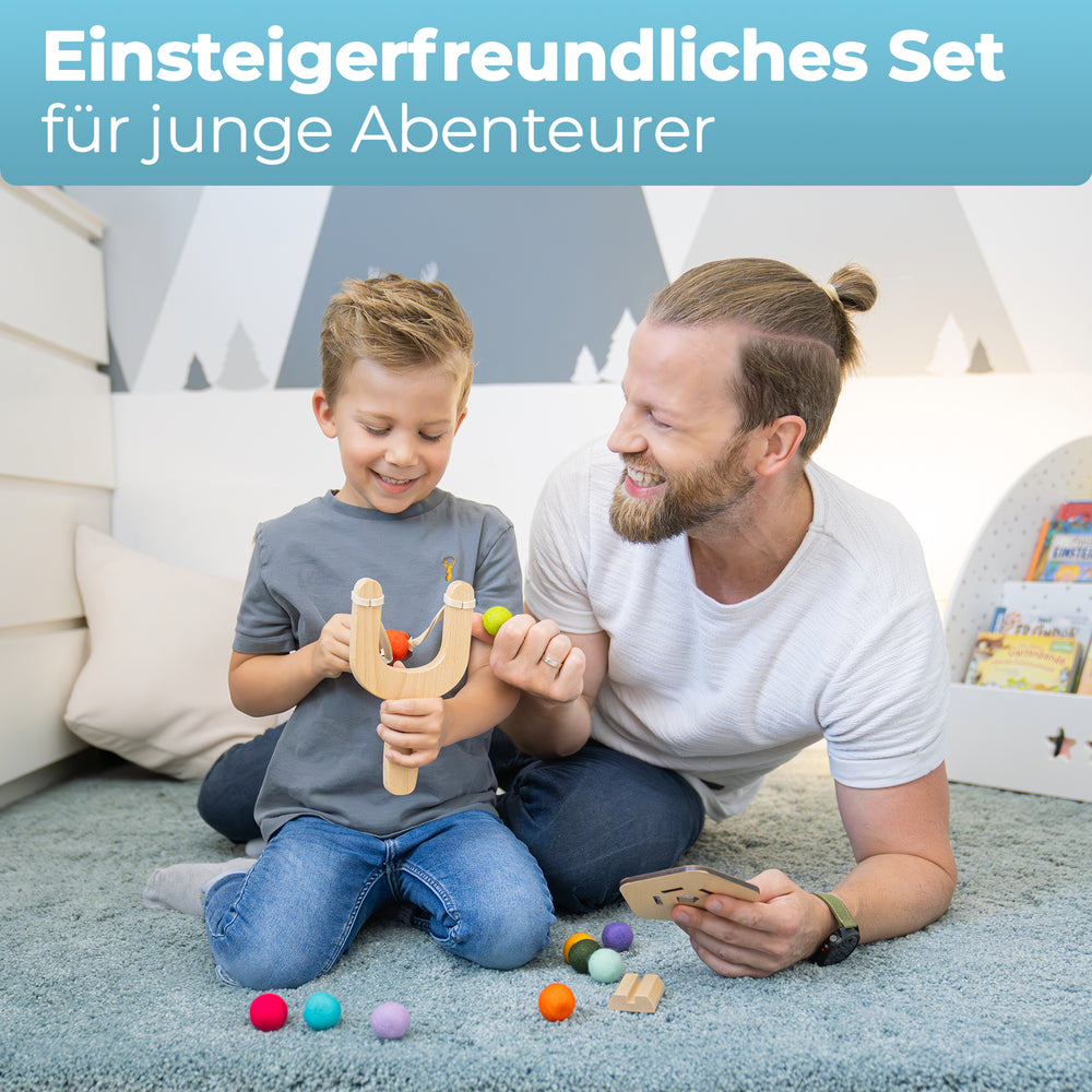 Wooden adventurer slingshot set with felt balls, wooden targets & storage bag